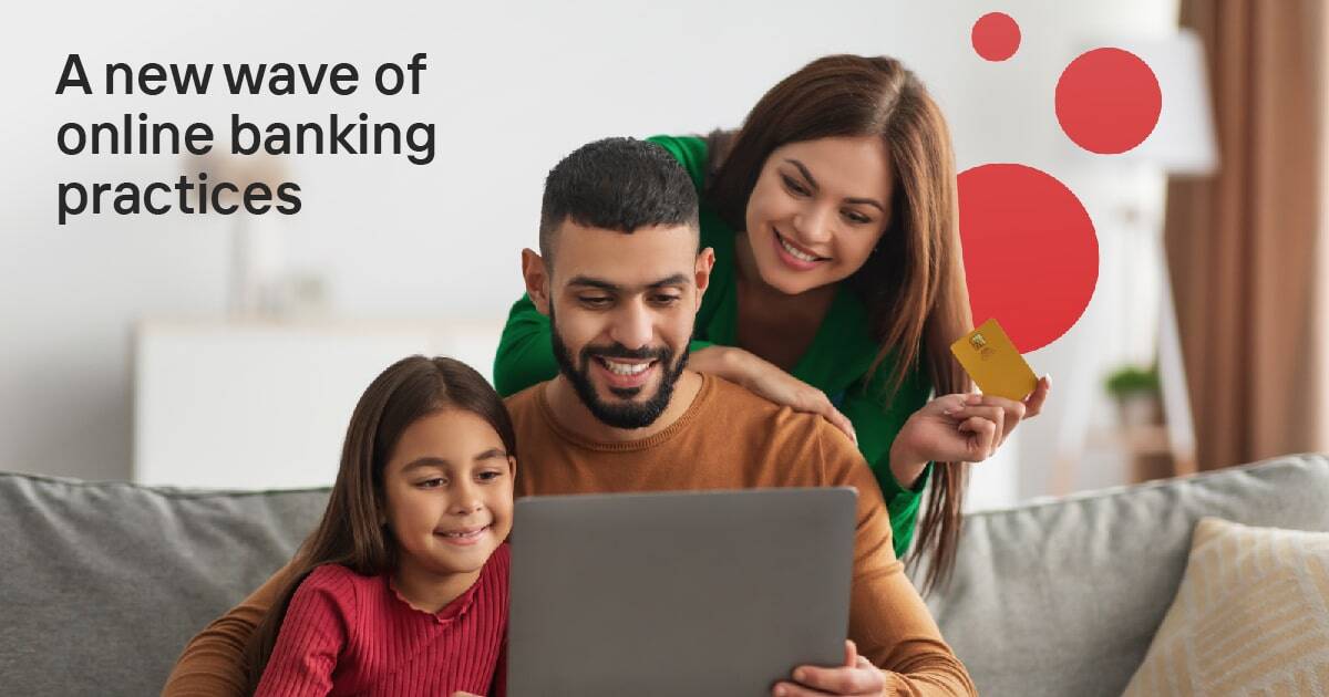 a family smiling in front of a laptop